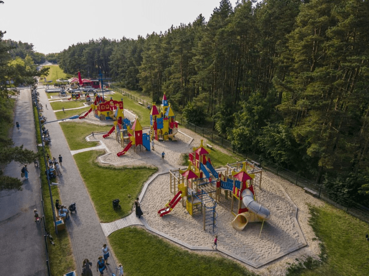 Children playing on colorful playground equipment